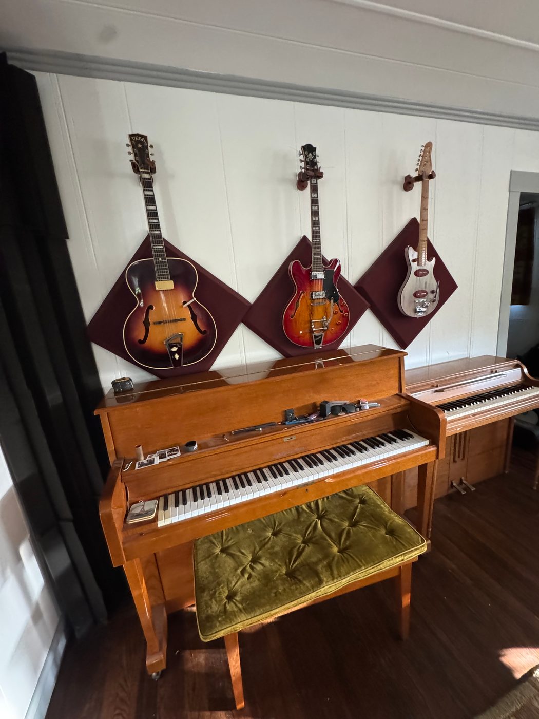 Upright piano and guitars in the live room
