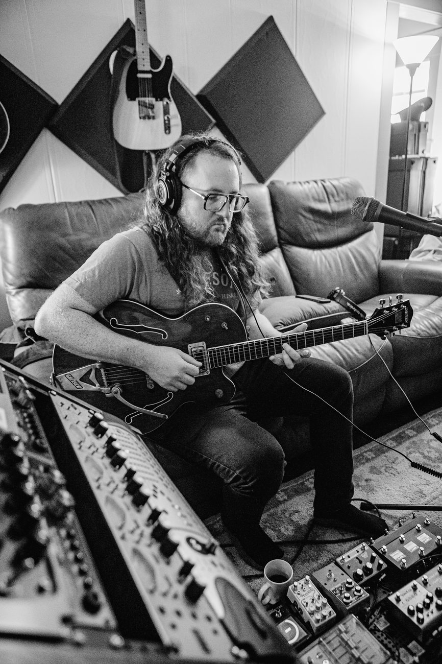 Electric guitar tracked from the control room couch